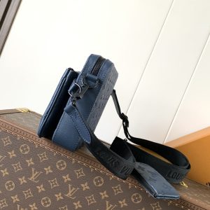 Alternative view of 46602 Messenger Bag Crafted from supple Monogram Shadow Hx embossed calf leather, infusing the modern Monogram jm embossed pattern with vibrant hues. The streamlined silhouette features a main compartment and a detachable front zip pocket, with a shoulder strap equipped with a removable coin purse. Dimensions: 18.5 x 7 x 25 cm.